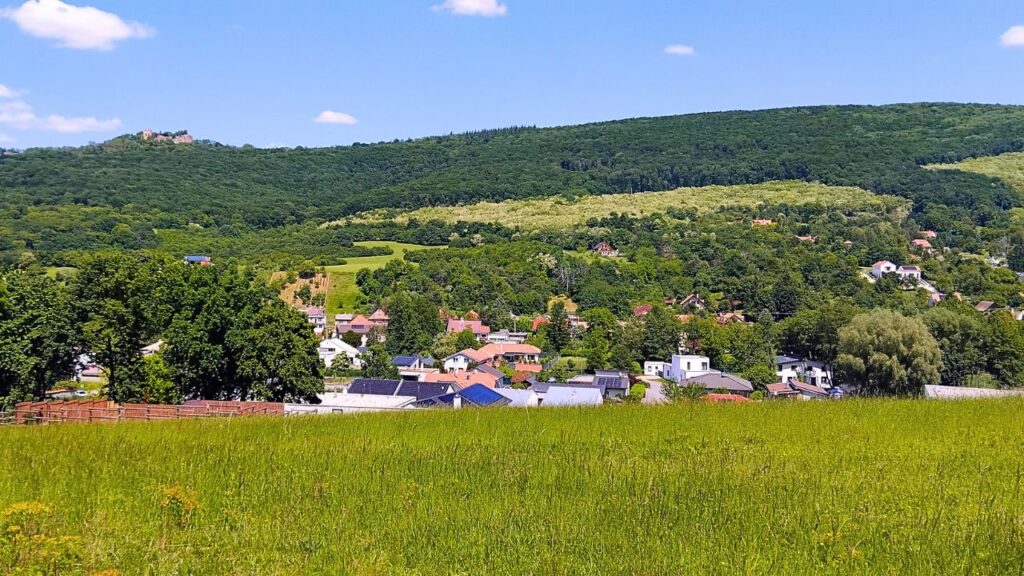 Borinka Village with Pajštún Castle ruin in the distance